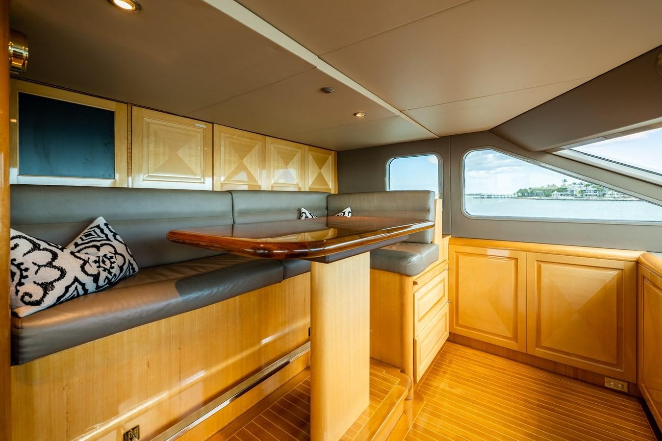 a kitchen with a wood table aboard SEAQUEST Yacht for Sale