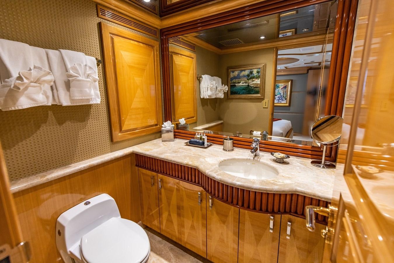 a bathroom with a large mirror aboard SEAQUEST Yacht for Sale