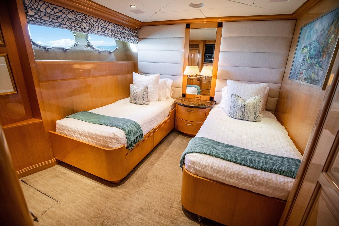 a couple of beds in a hotel room aboard SEAQUEST Yacht for Sale