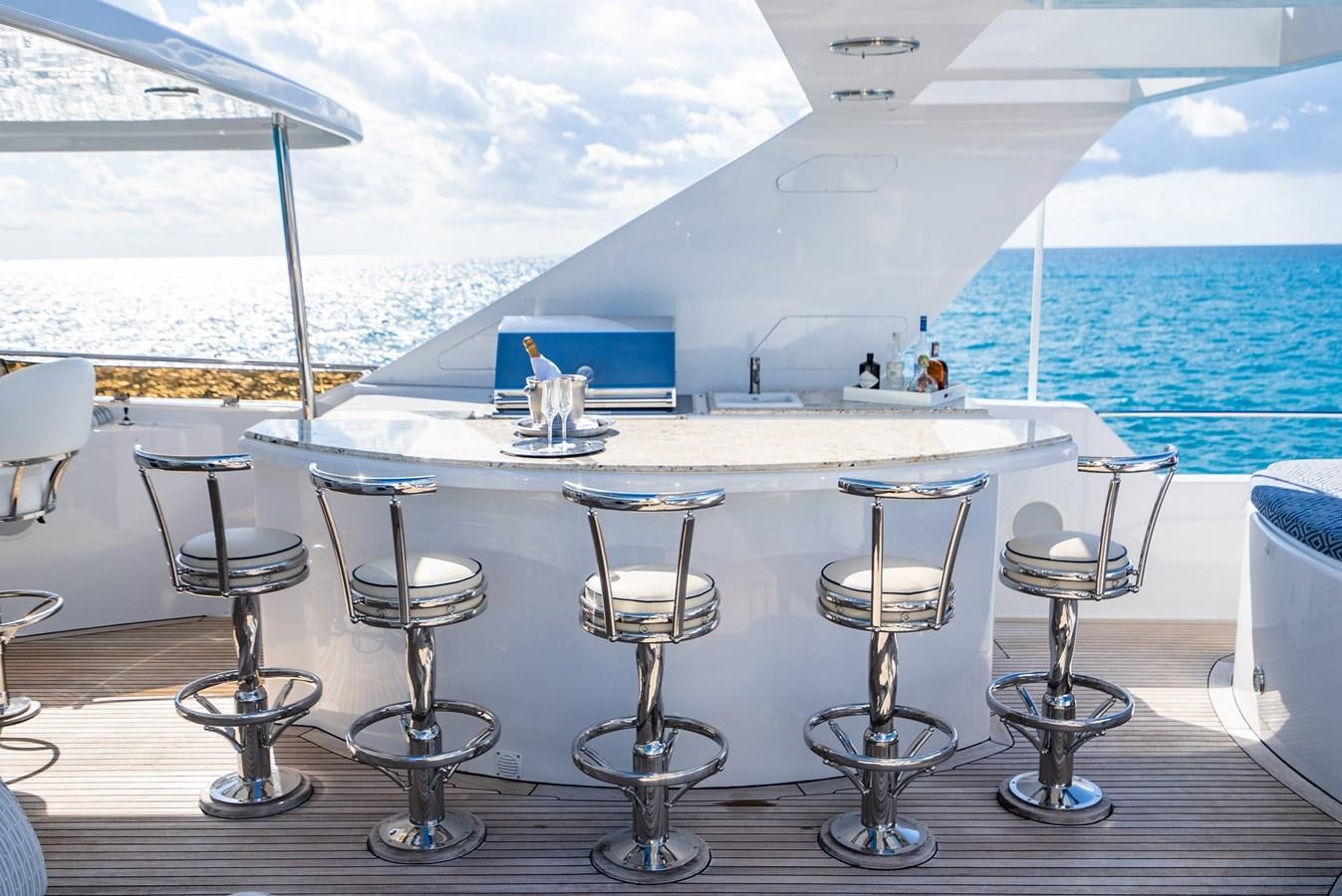a table with chairs on it aboard SEAQUEST Yacht for Sale