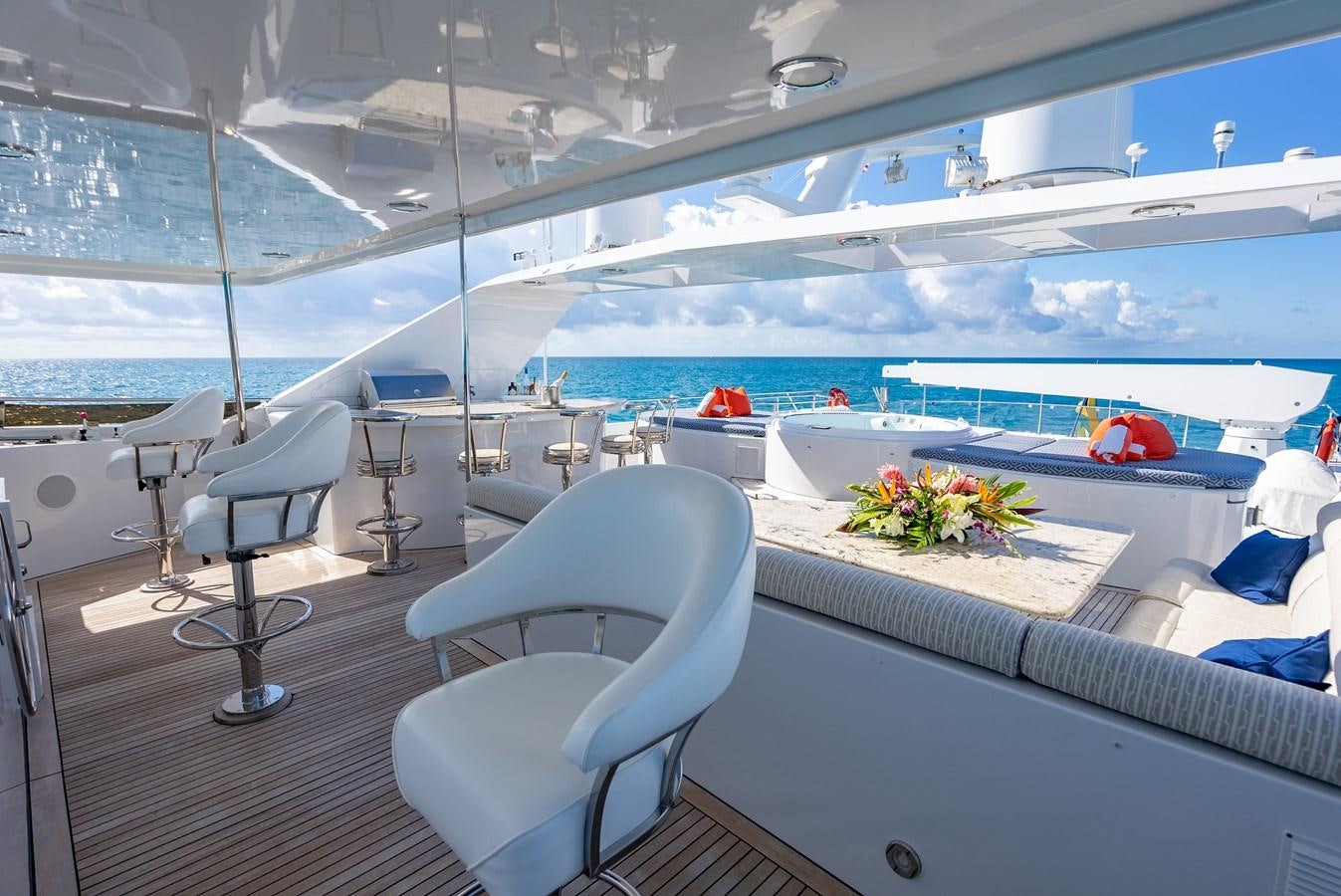 a room with a view of the ocean and the deck aboard SEAQUEST Yacht for Sale