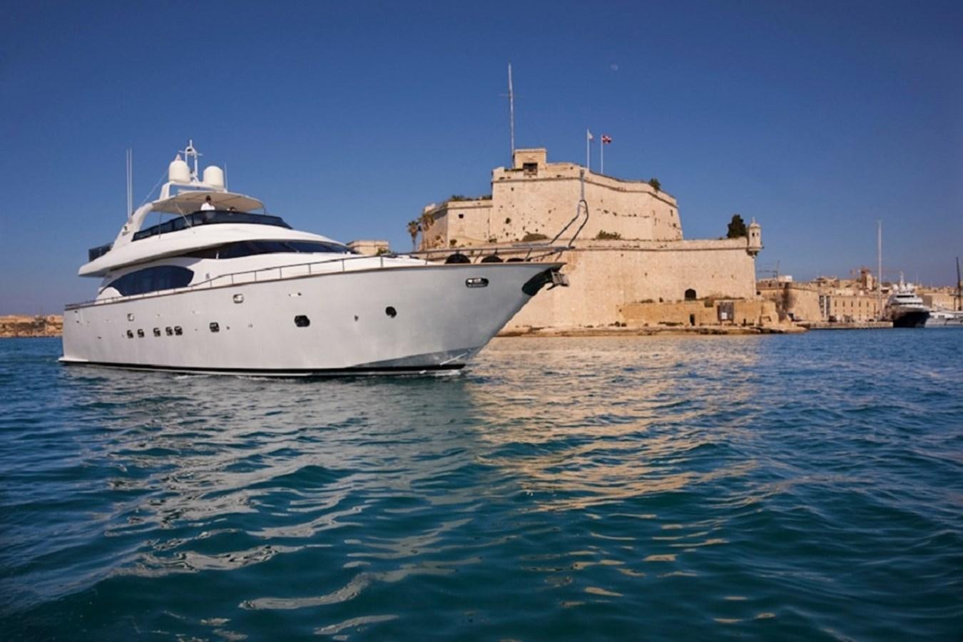 a large white boat in the water aboard MEME Yacht for Sale