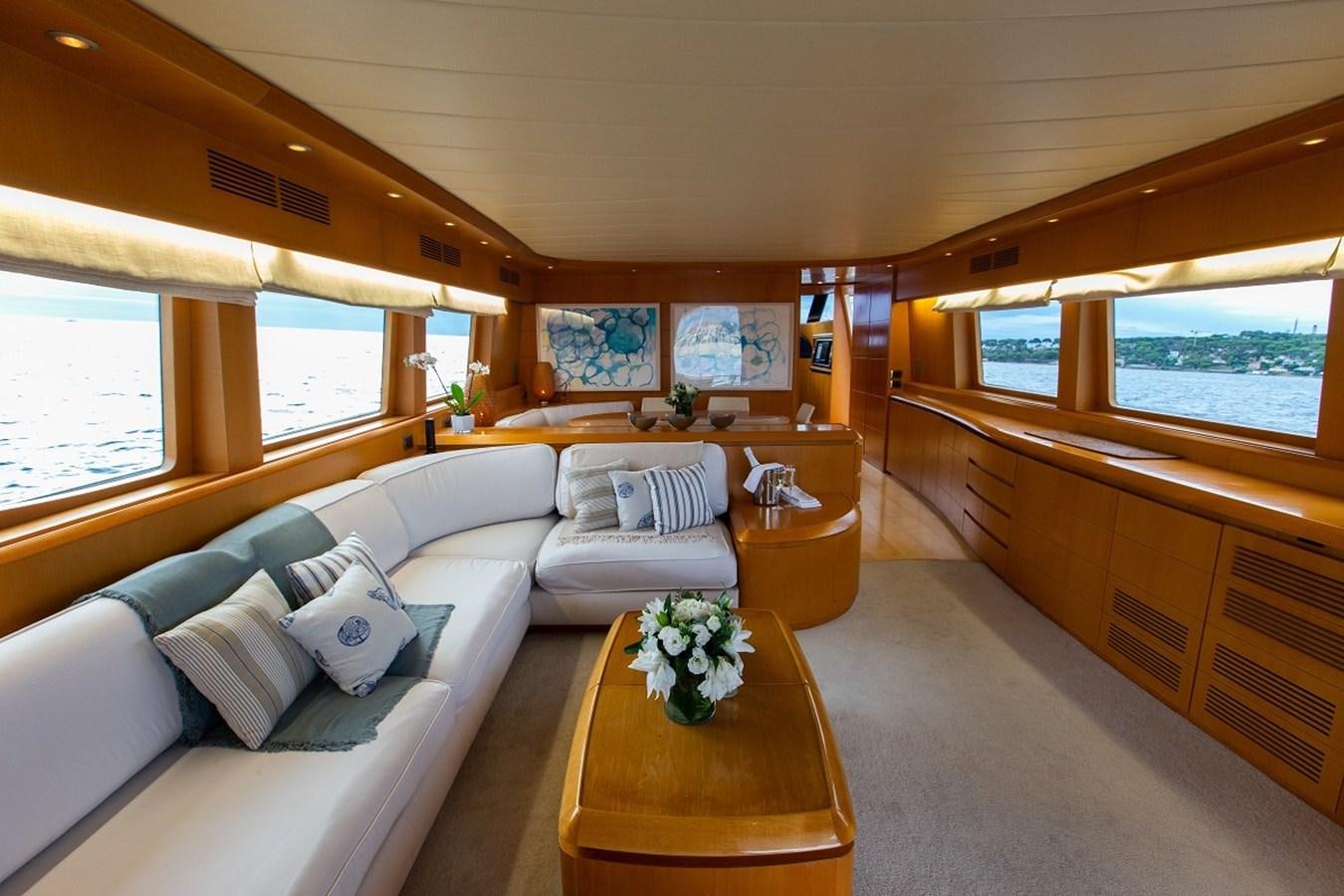a large living room with a large window aboard MEME Yacht for Sale