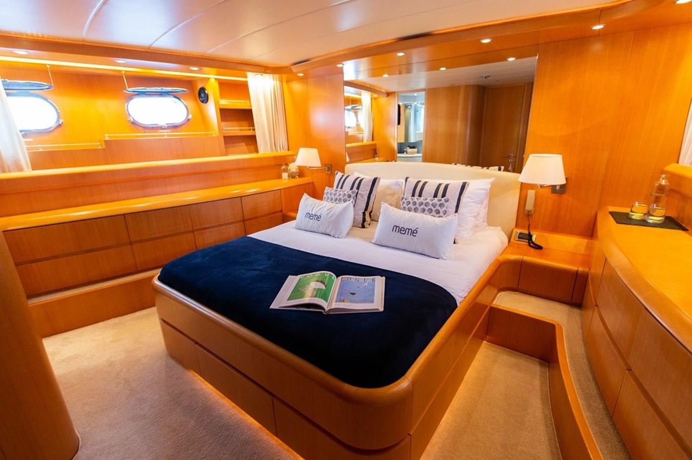 a room with a bed and a desk aboard MEME Yacht for Sale