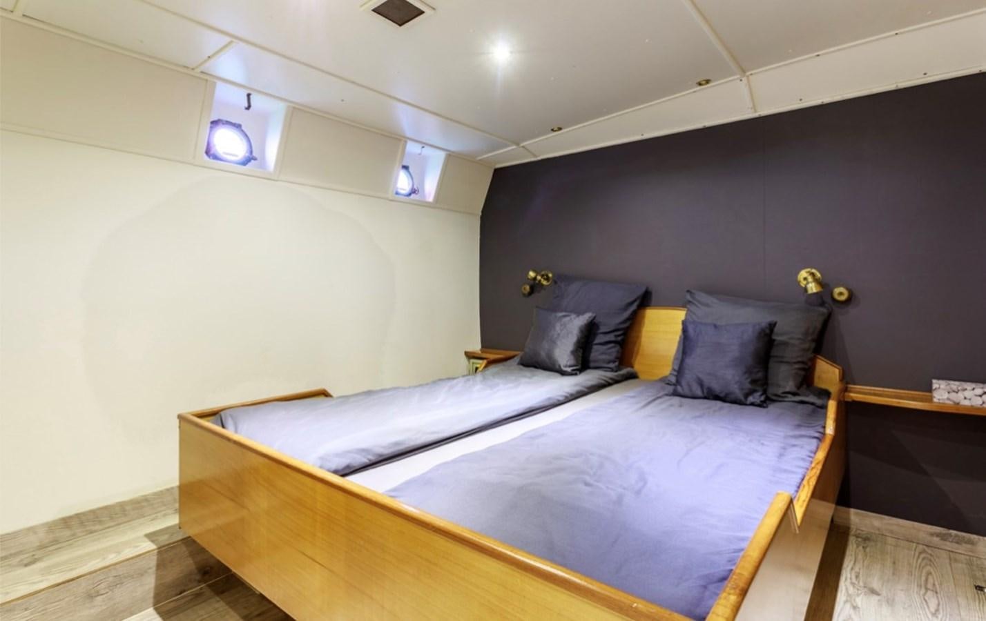 a room with two beds aboard FAMILY Yacht for Sale