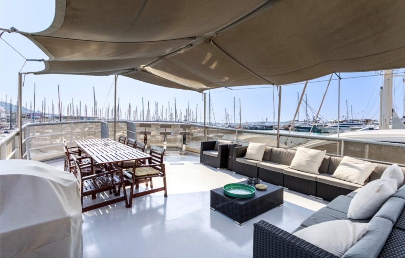 a living room with a large patio aboard FAMILY Yacht for Sale