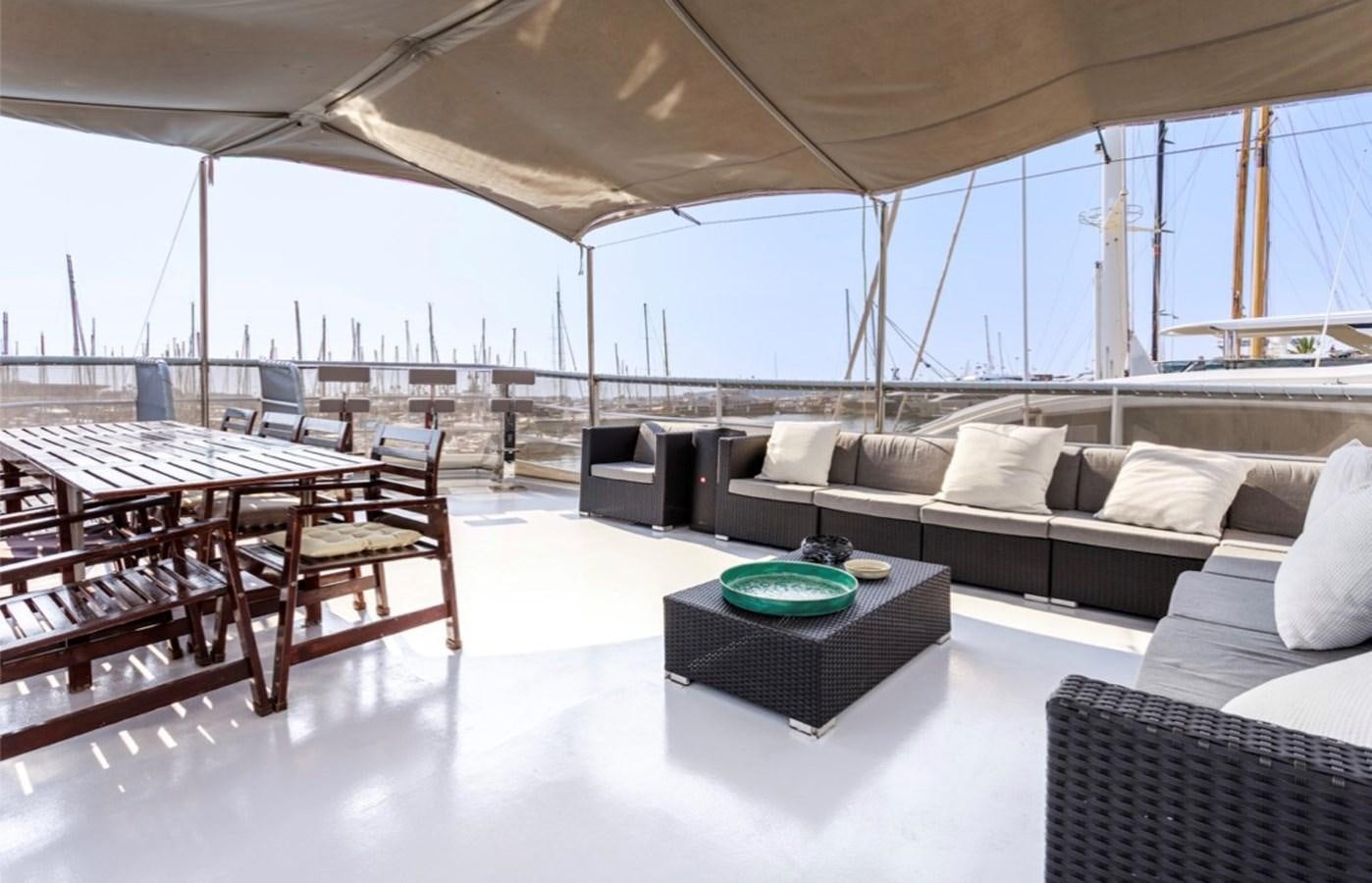 a living room with a couch and a table aboard FAMILY Yacht for Sale