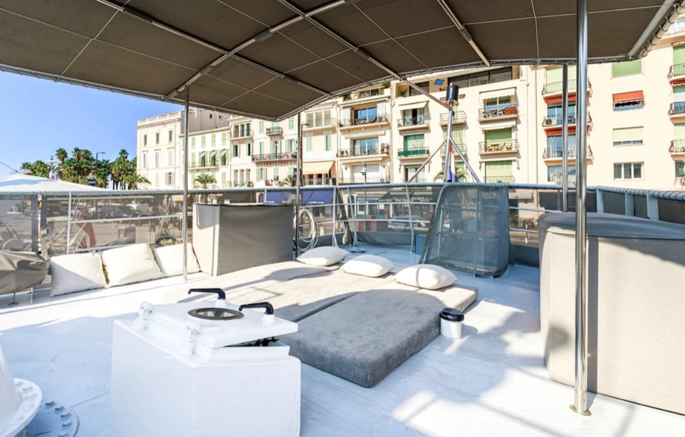 a room with a bed and a table aboard FAMILY Yacht for Sale