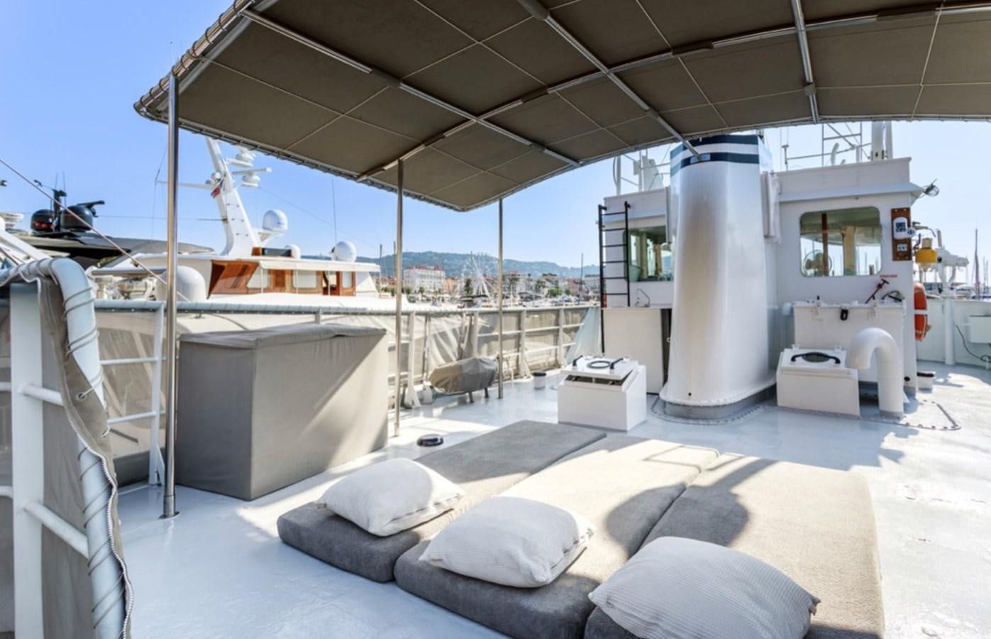a large white machine aboard FAMILY Yacht for Sale