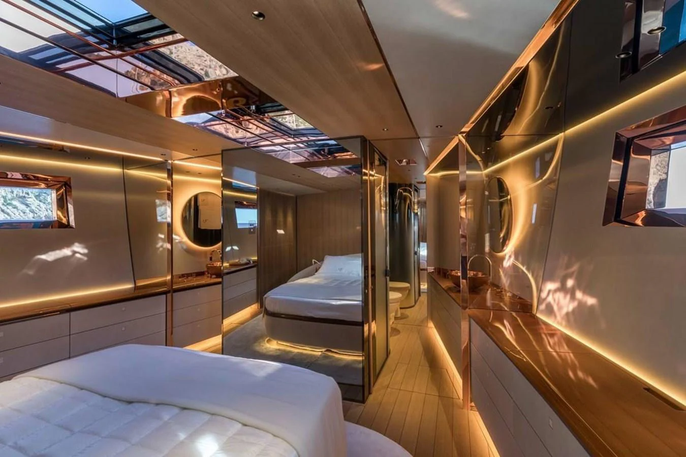 a room with a bed and a mirror aboard RIBELLE Yacht for Sale