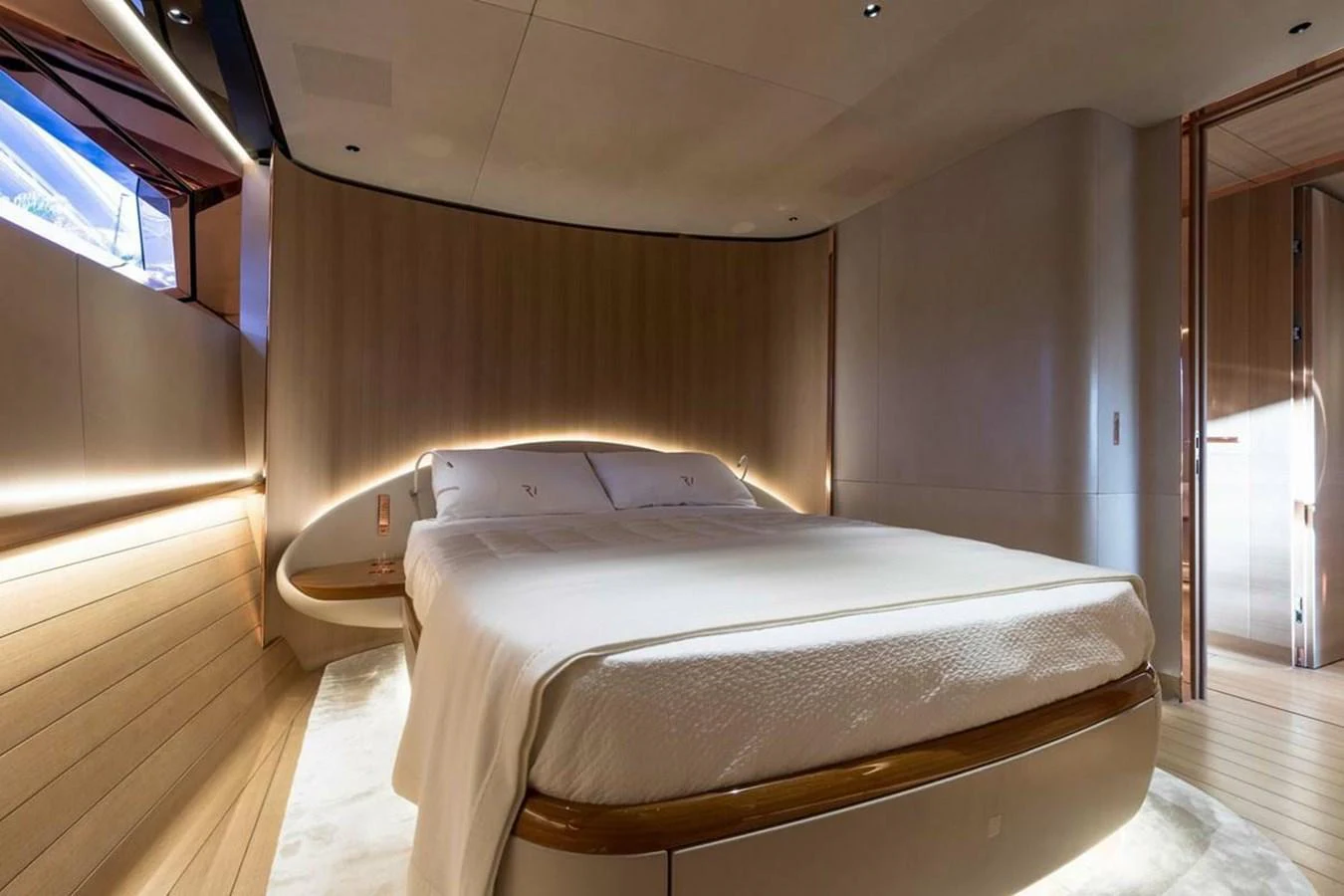a bed in a room aboard RIBELLE Yacht for Sale