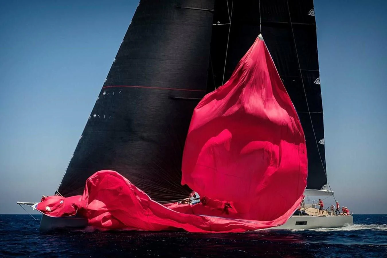 a large red sailboat aboard RIBELLE Yacht for Sale