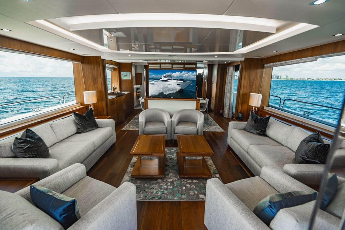 a living room with a large screen aboard GALLIVANT Yacht for Sale