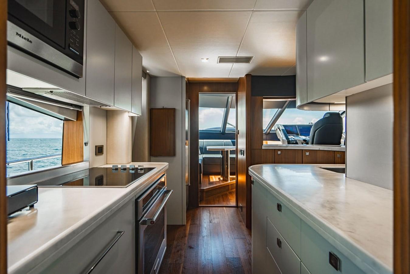a kitchen with a large island aboard GALLIVANT Yacht for Sale