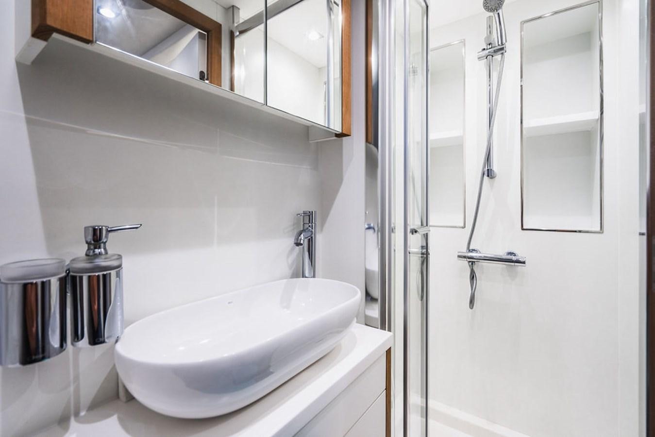 a bathroom with a sink and a mirror aboard GALLIVANT Yacht for Sale