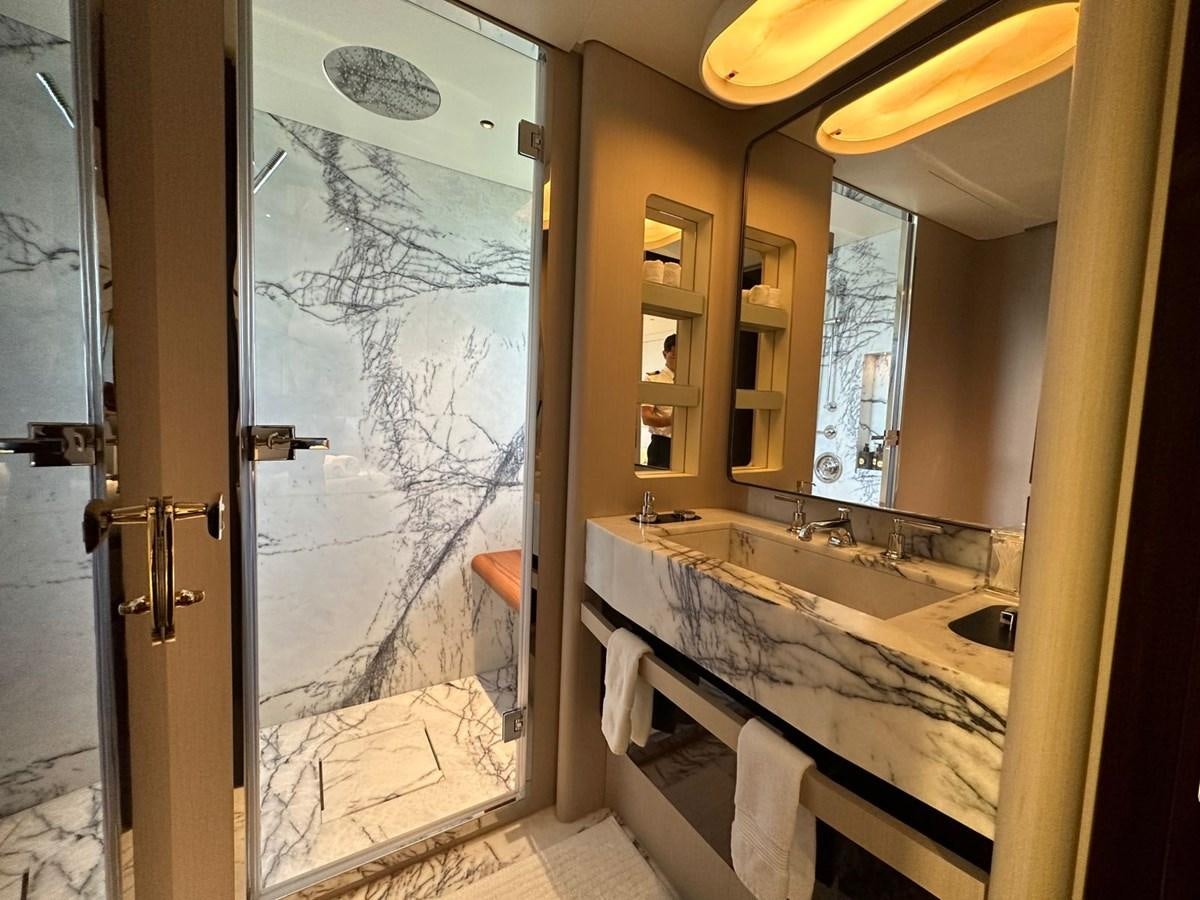a bathroom with a glass shower aboard NG Yacht for Sale