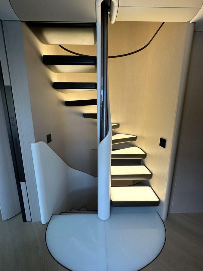 a white shelf with black cables aboard NG Yacht for Sale