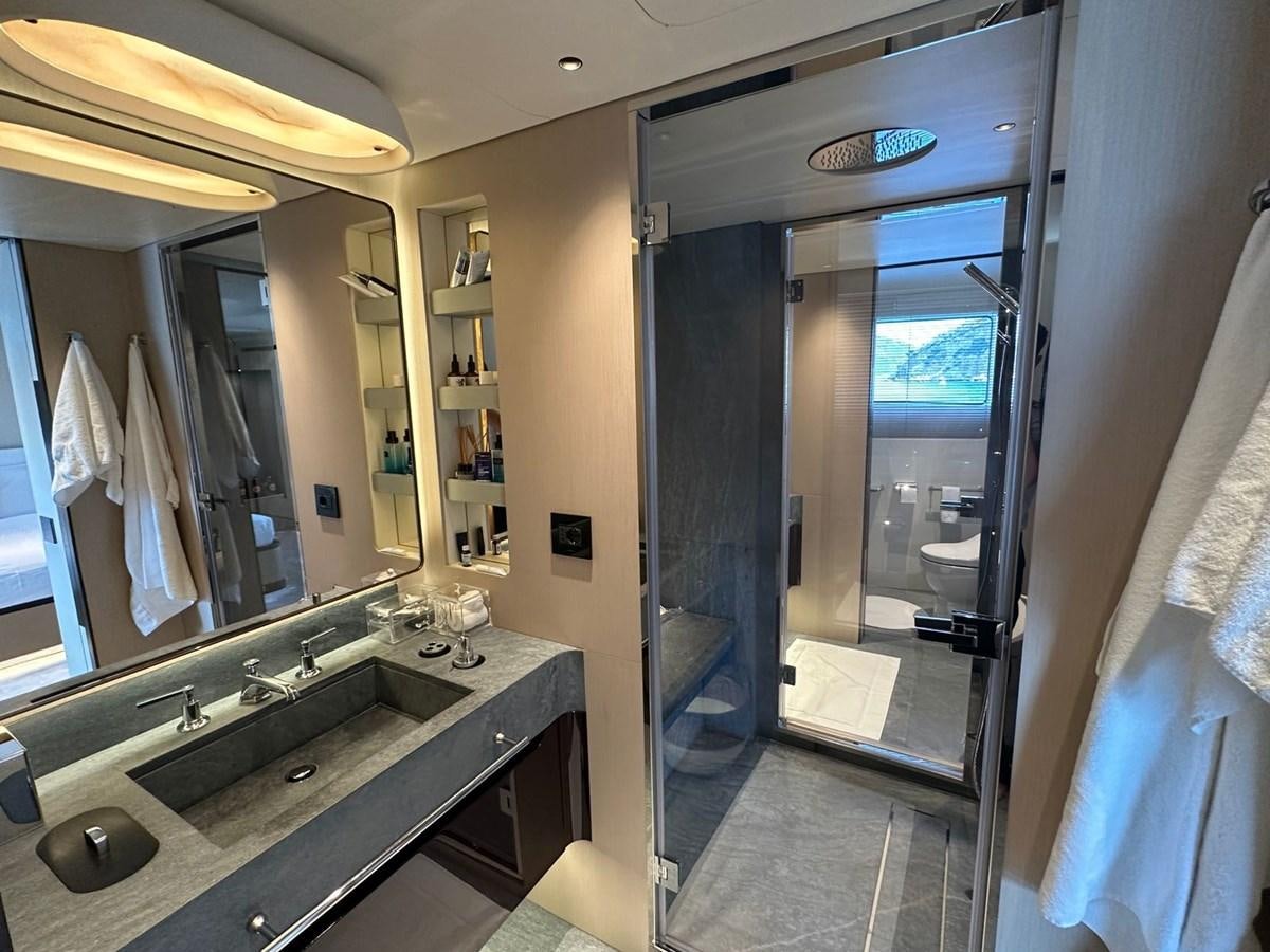 a bathroom with a large mirror aboard NG Yacht for Sale