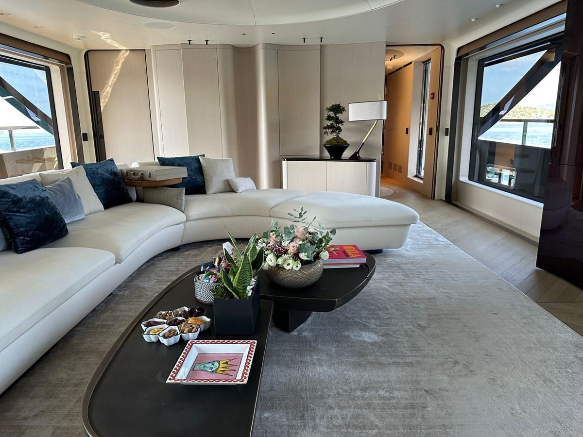 a living room with a white couch aboard NG Yacht for Sale