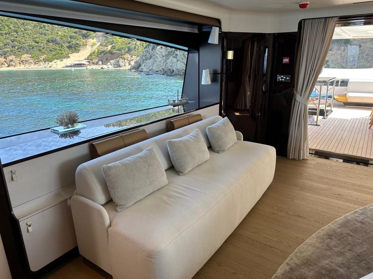 a living room with a large window aboard NG Yacht for Sale