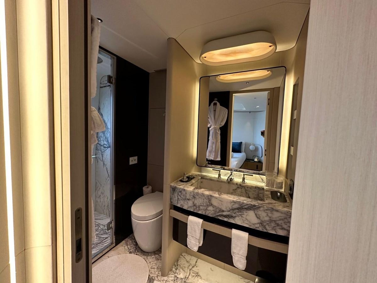 a bathroom with a large mirror aboard NG Yacht for Sale