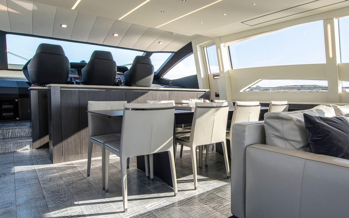 a room with a table and chairs aboard ALDEBARAN III Yacht for Sale