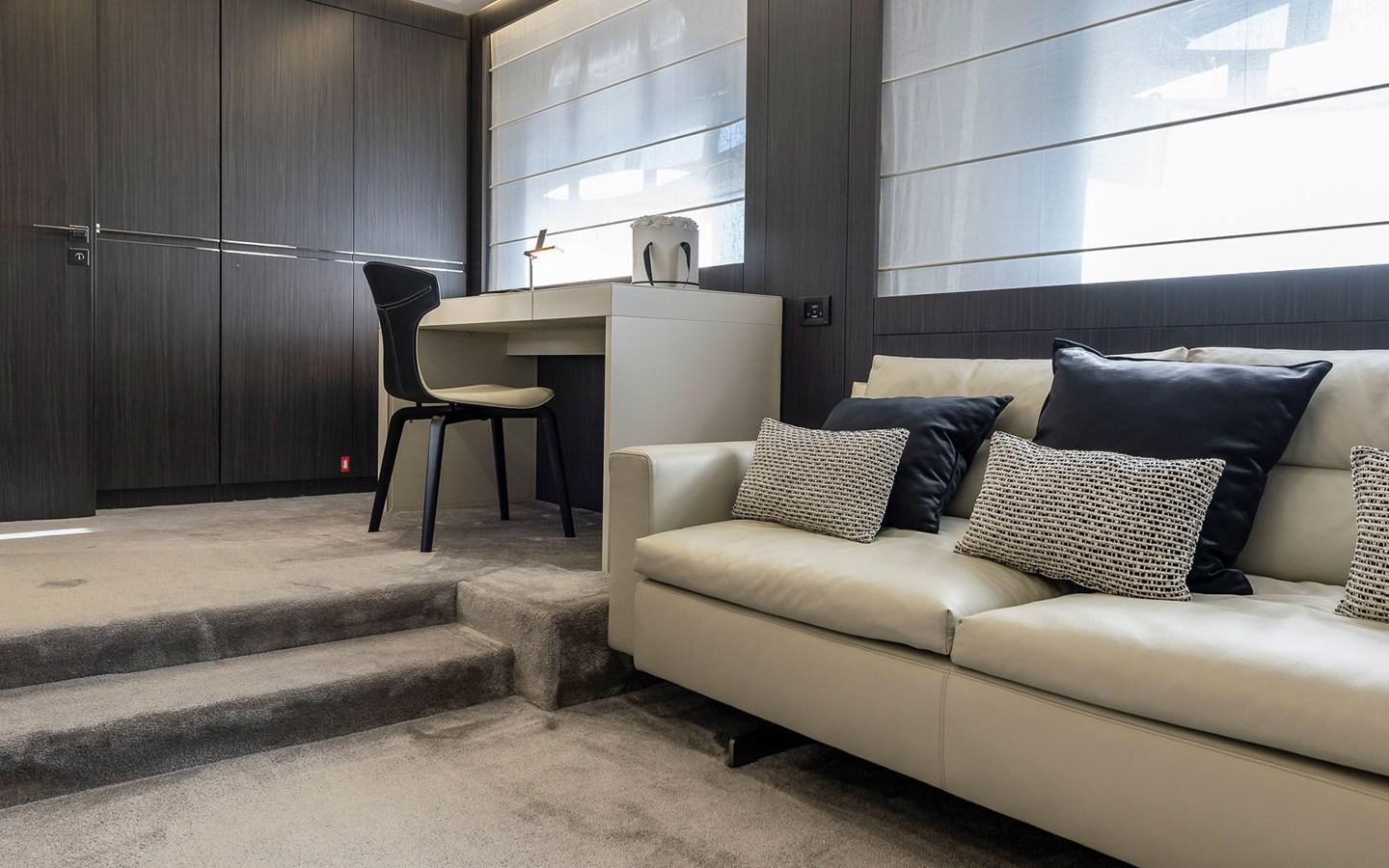 a couch and a chair in a room aboard ALDEBARAN III Yacht for Sale