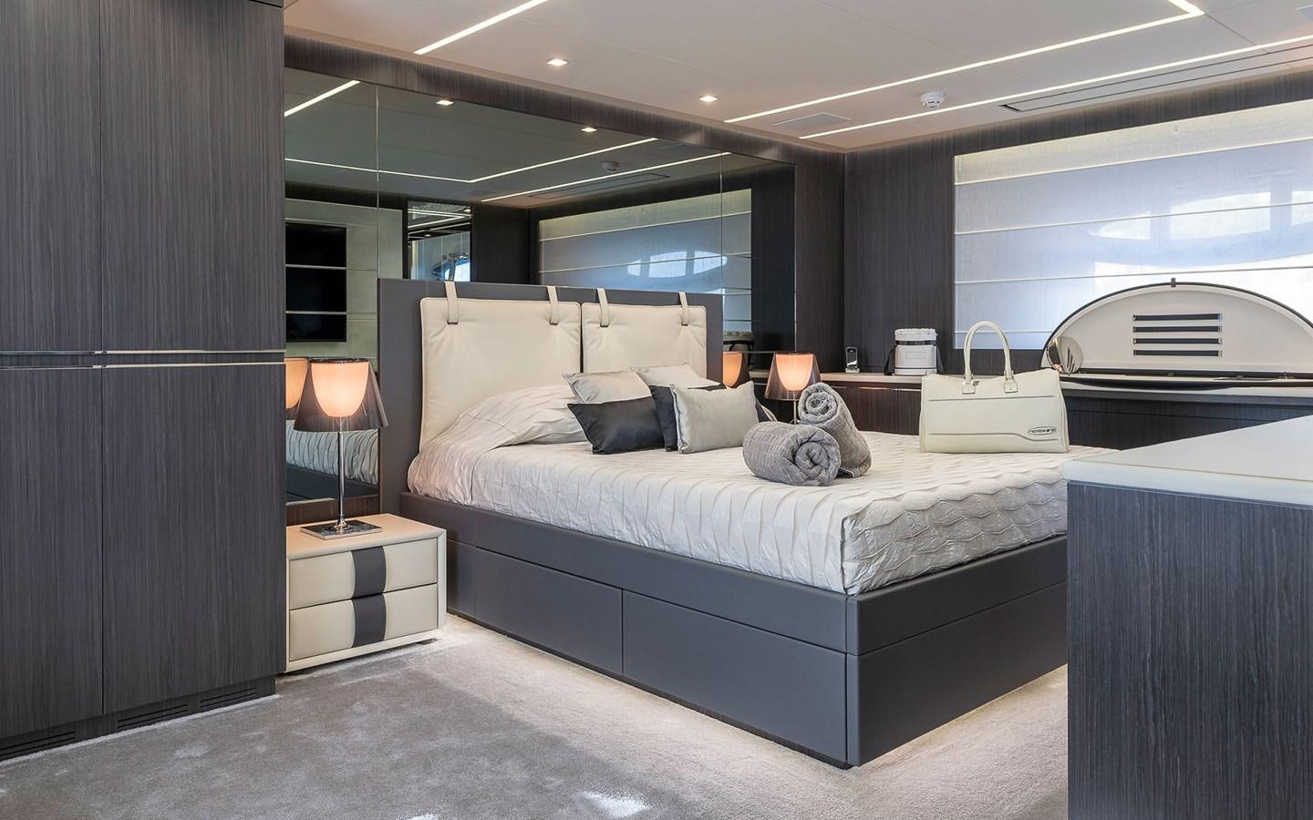 a large bedroom with a large bed aboard ALDEBARAN III Yacht for Sale