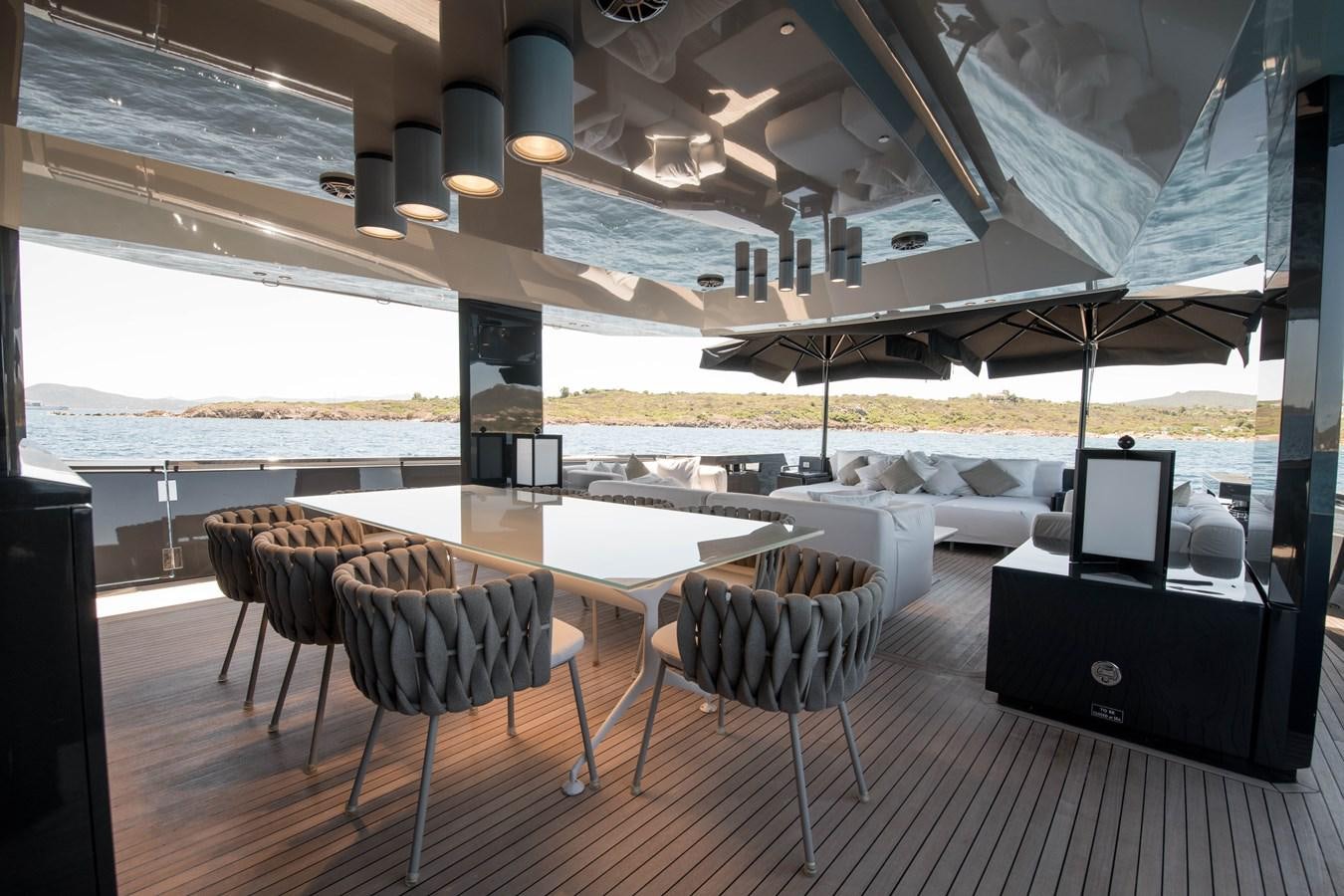 a room with a table and chairs aboard NIGHT FURY Yacht for Sale