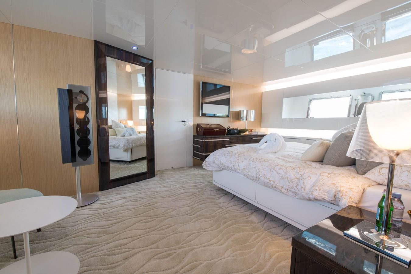 a hotel room with a bed and a desk aboard NIGHT FURY Yacht for Sale