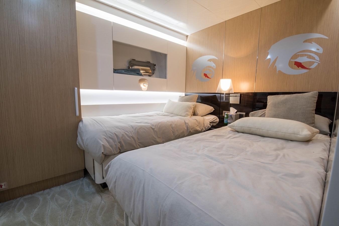a room with two beds aboard NIGHT FURY Yacht for Sale