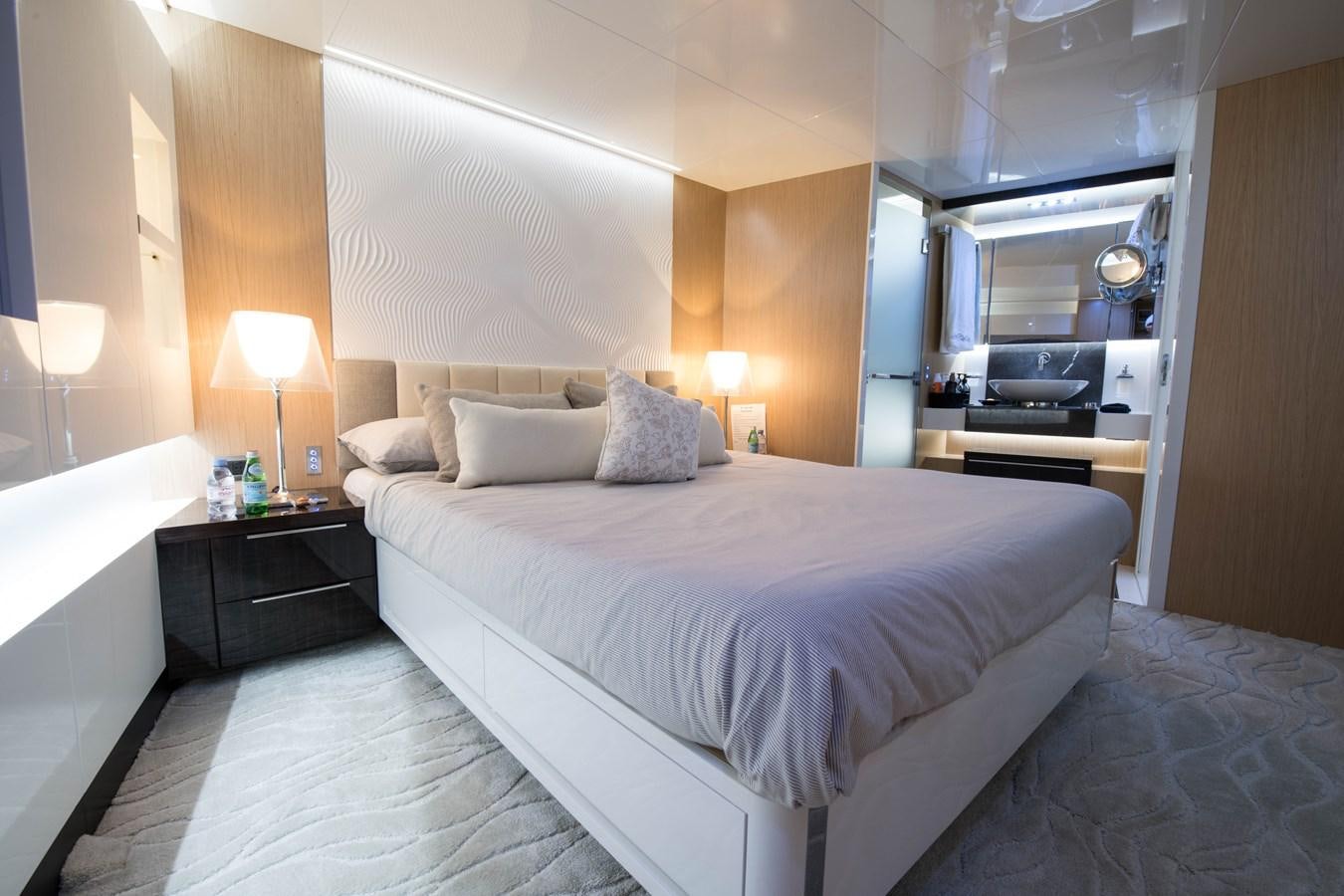 a bed with a white sheet aboard NIGHT FURY Yacht for Sale