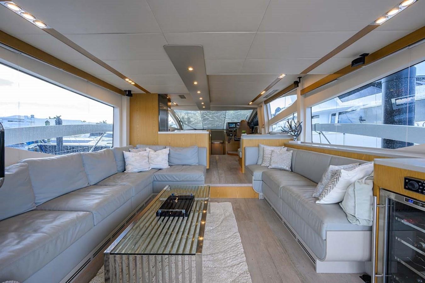 a living room with a couch and a table aboard XHALE Yacht for Sale