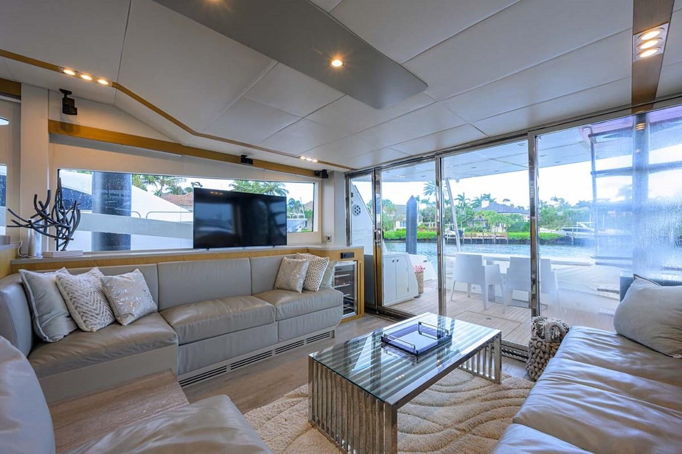 a living room with a large glass window aboard XHALE Yacht for Sale
