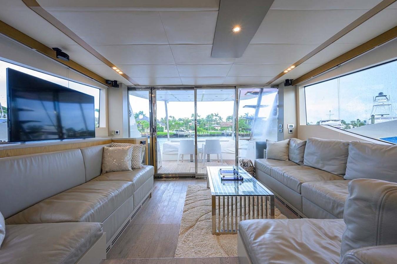 a living room with a large window aboard XHALE Yacht for Sale