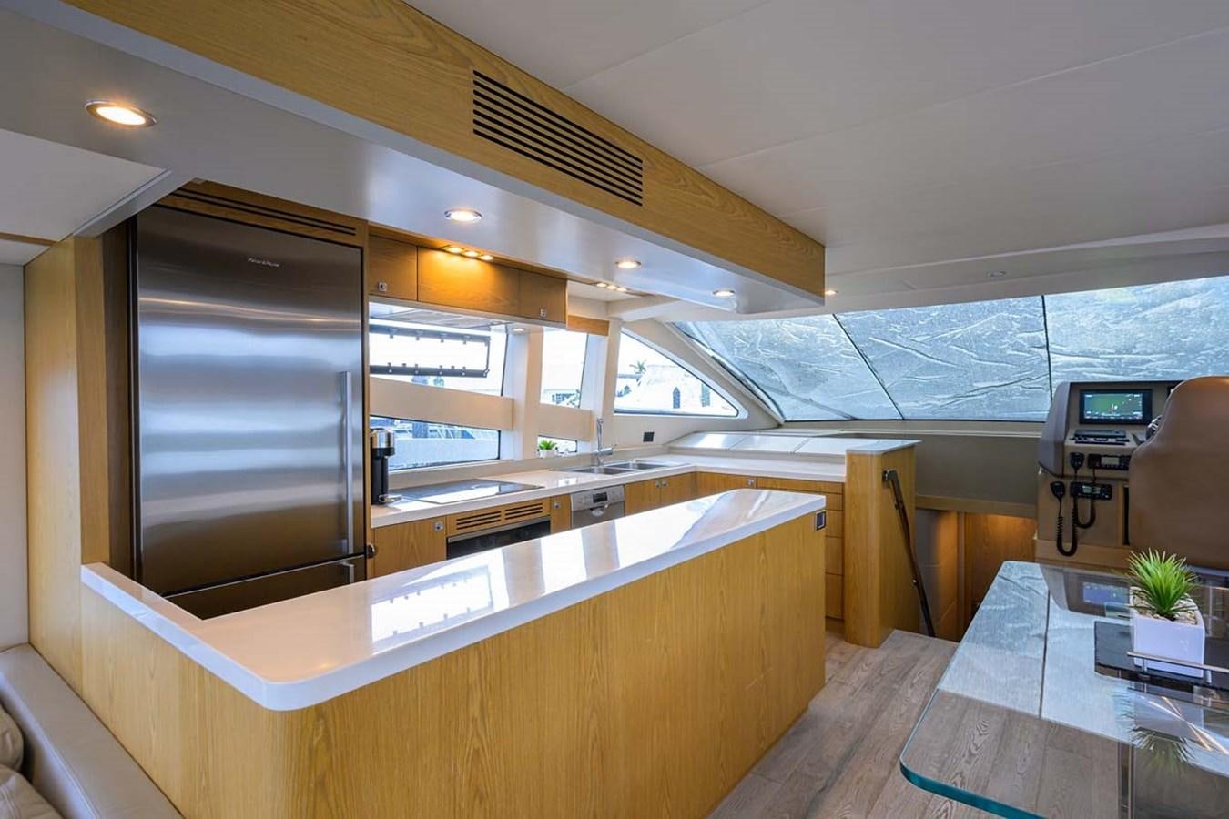 a room with a large window and a desk with a computer aboard XHALE Yacht for Sale