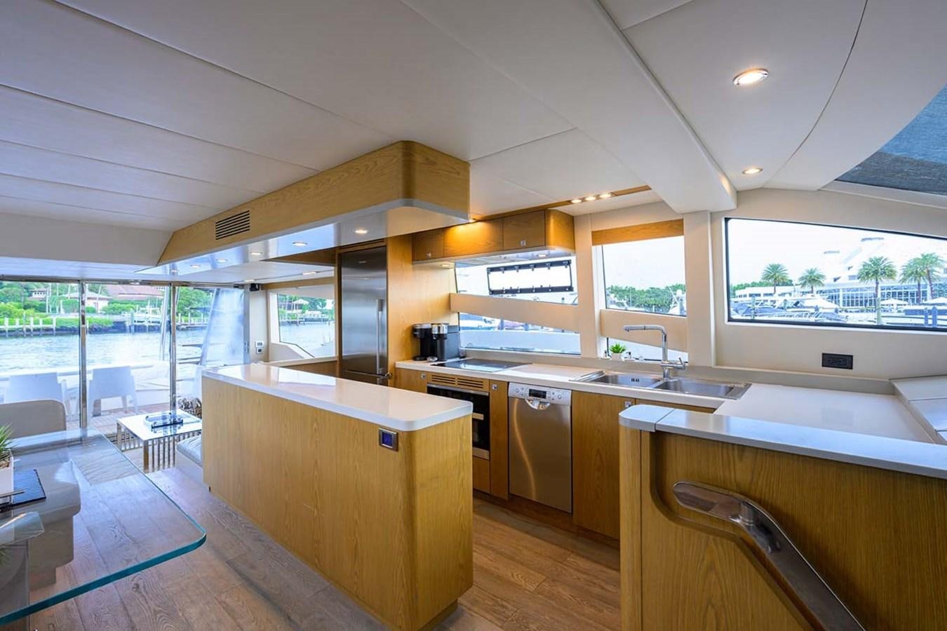 a kitchen with a large window aboard XHALE Yacht for Sale
