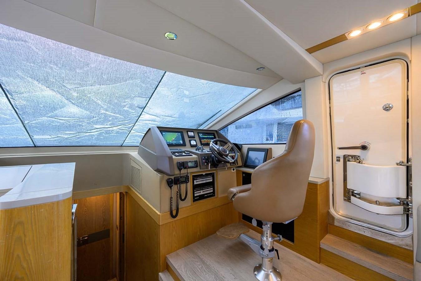 a room with a chair and a desk aboard XHALE Yacht for Sale