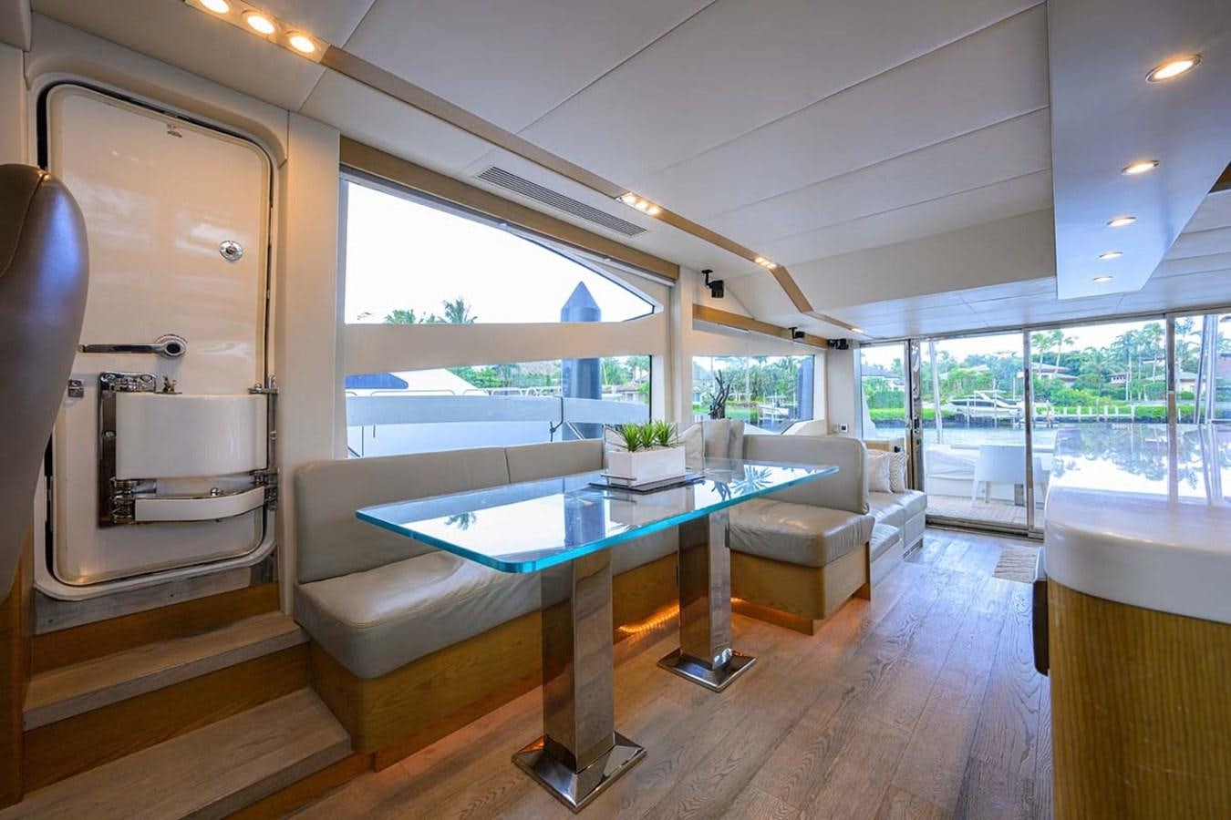 a room with a pool table and chairs aboard XHALE Yacht for Sale