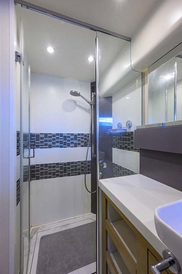 a shower unit in a bathroom aboard XHALE Yacht for Sale