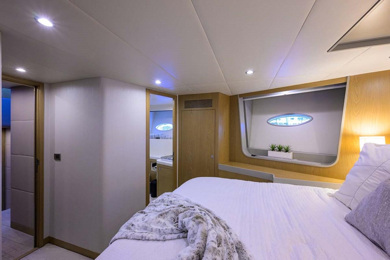 a bed in a room aboard XHALE Yacht for Sale