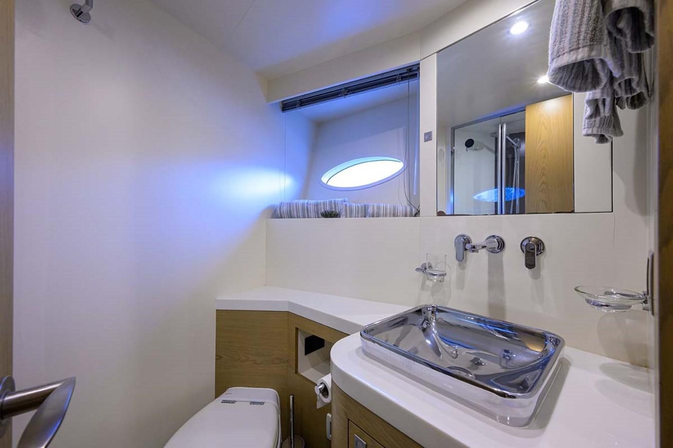 a bathroom with a sink and a mirror aboard XHALE Yacht for Sale