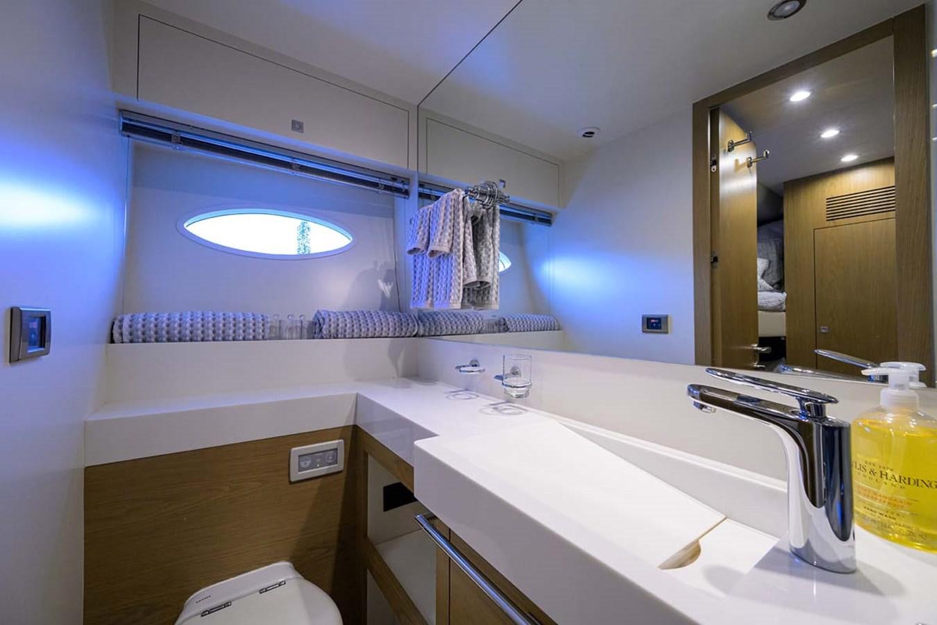a bathroom with a sink and a mirror aboard XHALE Yacht for Sale