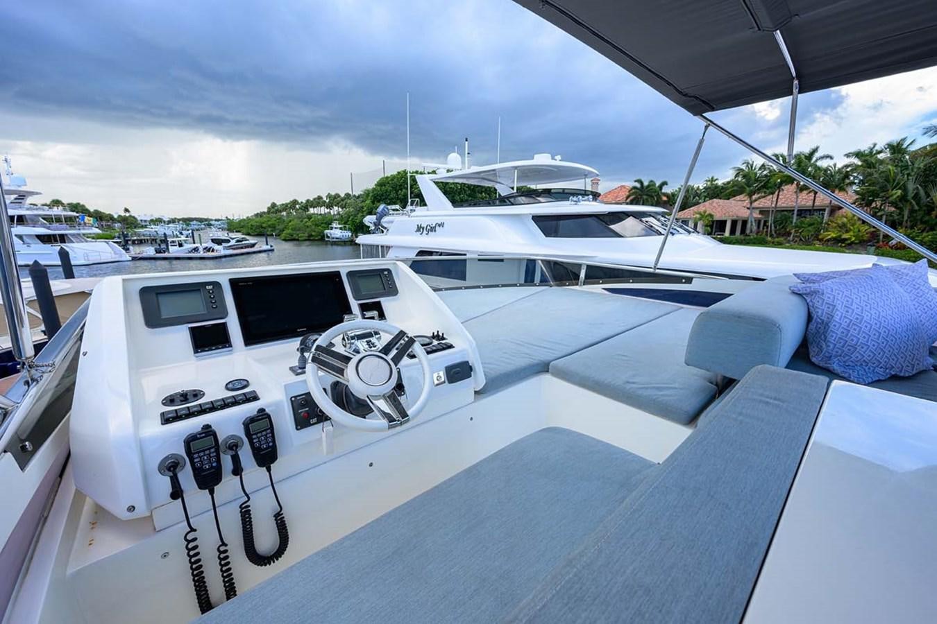 a white car parked on a boat aboard XHALE Yacht for Sale