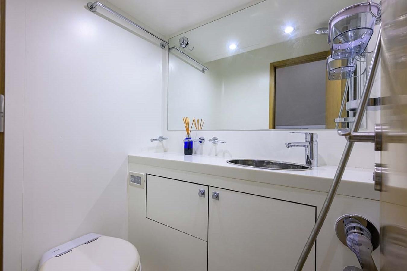 a bathroom with a sink and a mirror aboard XHALE Yacht for Sale
