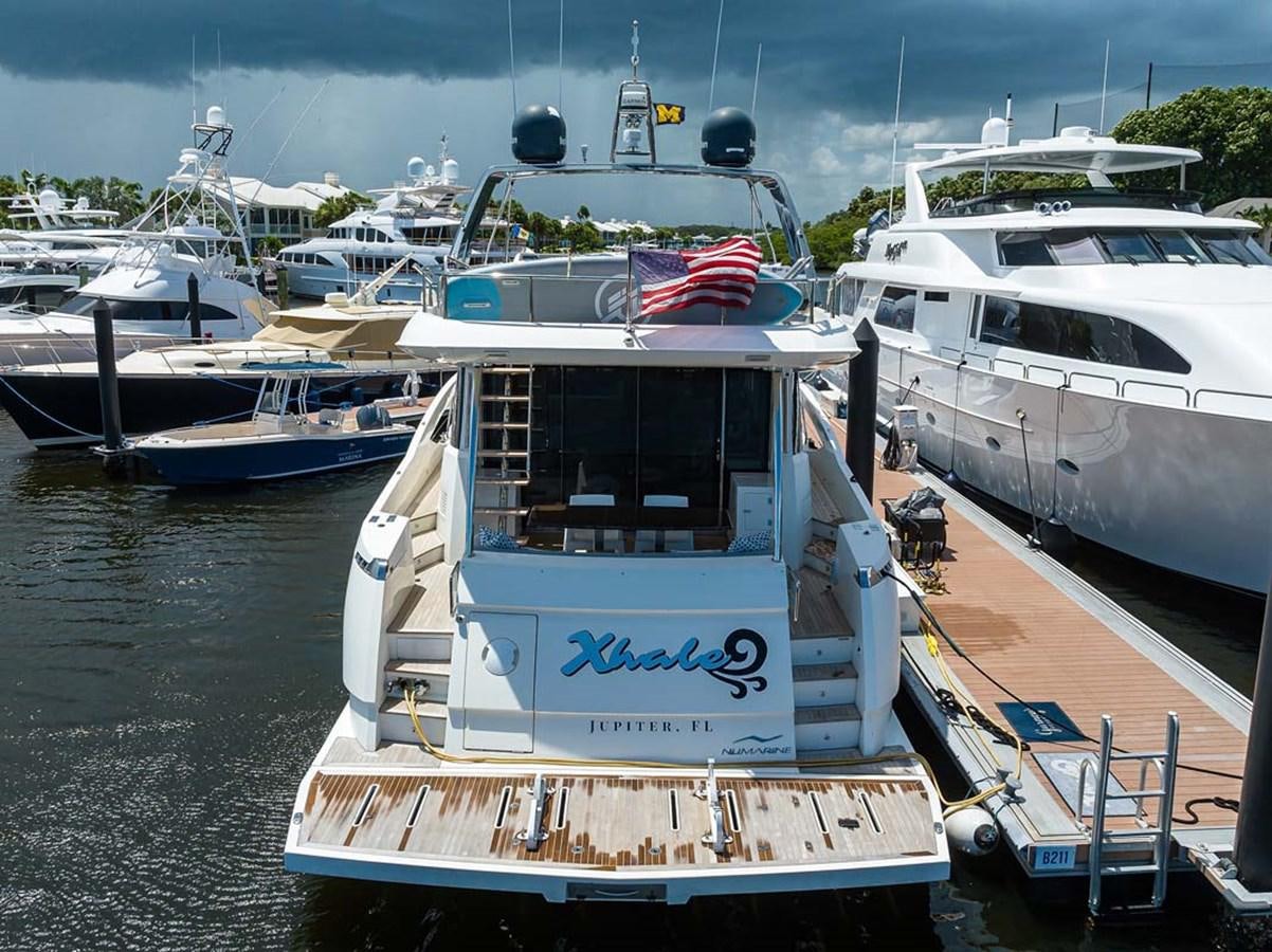 a boat docked at a pier aboard XHALE Yacht for Sale