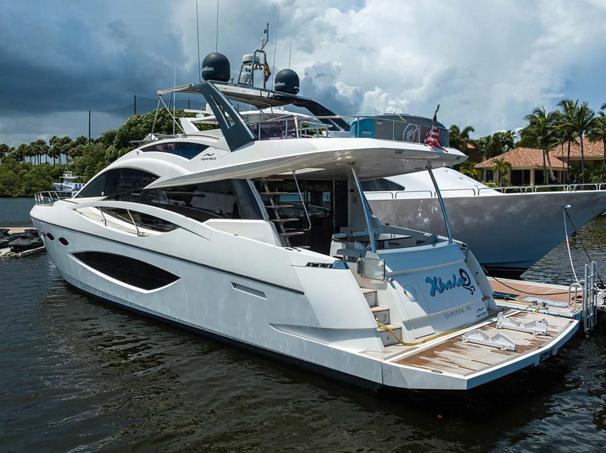 a boat docked at a pier aboard XHALE Yacht for Sale