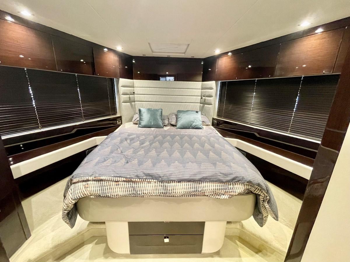a bed in a room aboard EXCELLENCE Yacht for Sale