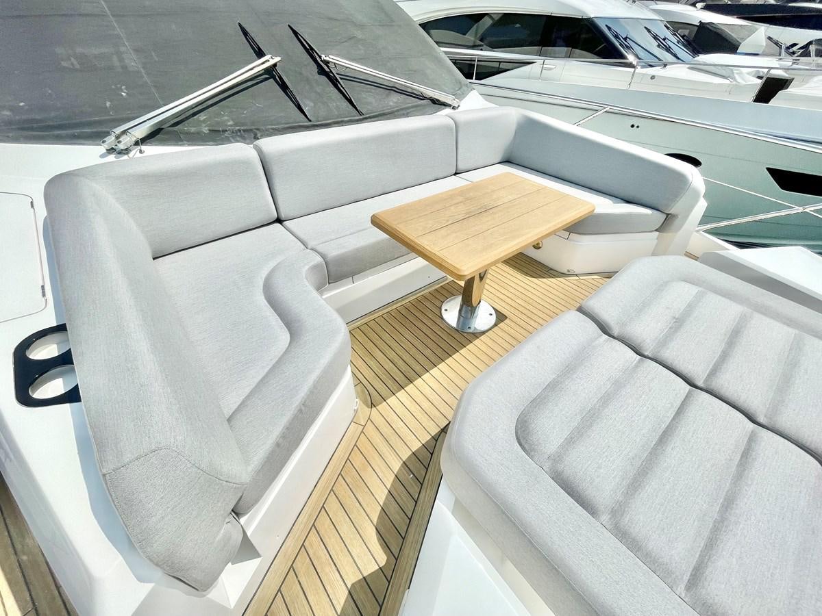 a wooden bench on a boat aboard EXCELLENCE Yacht for Sale