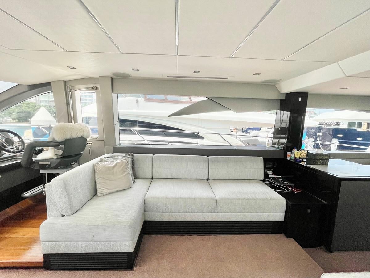 a couch in a room aboard EXCELLENCE Yacht for Sale